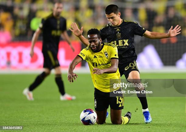 Kevin Molino of Columbus Crew is foulded by Sergi Palencia of Los Angeles FC during the second half during the 2023 MLS Cup at Lower.com Field on...