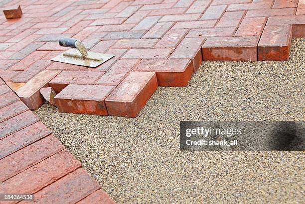 block paving under construction - block paving driveway stock pictures, royalty-free photos & images