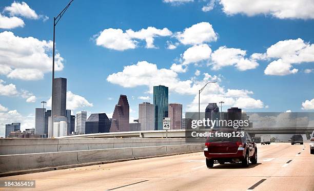 skyline, downtown city. houston texas usa. highway, interstate road. traffic. - houston texas downtown stock pictures, royalty-free photos & images