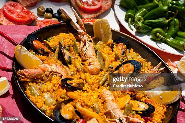 seafood paella - paella stock pictures, royalty-free photos & images