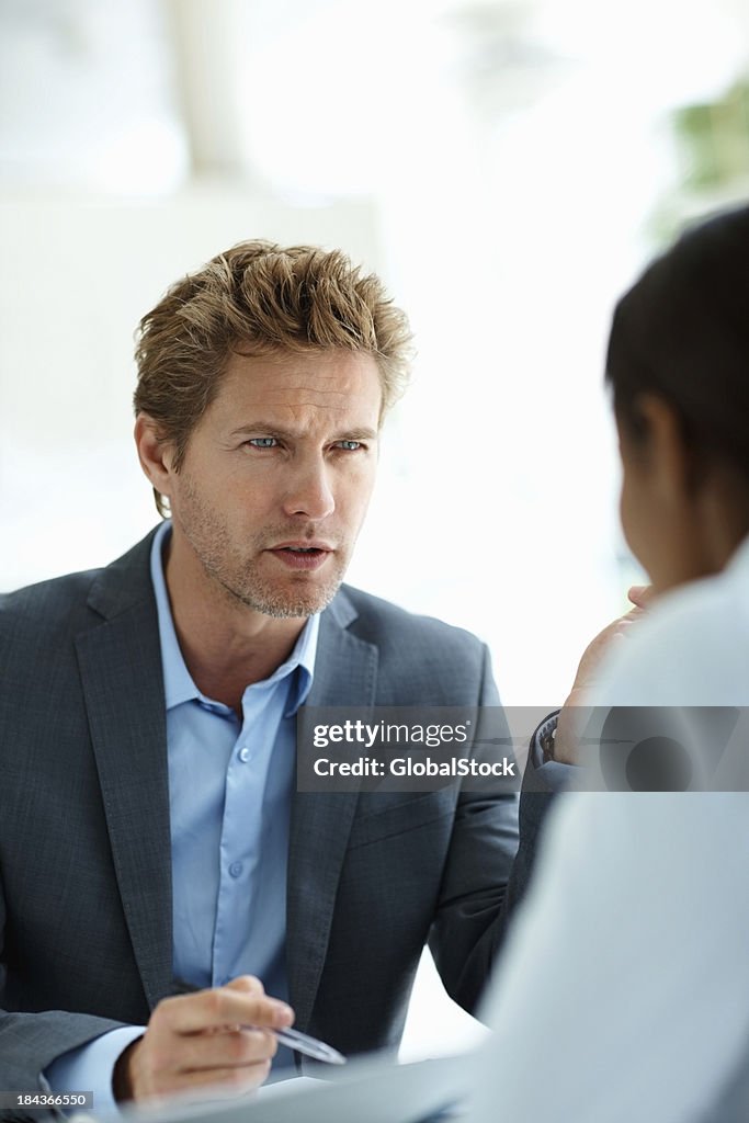 Business man interacting with female coworker