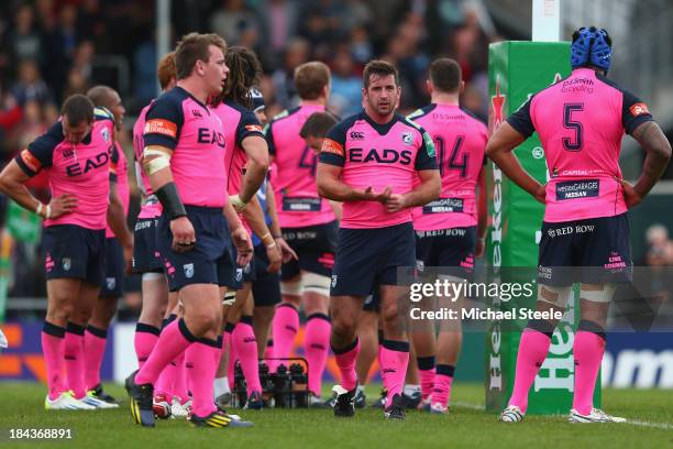 Dafydd Hewitt , Matthew Rees and Filo Paulo of Cardiff Blues look on after conceding a try during the Heineken Cup Pool Two match between Exeter...