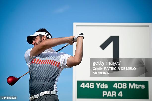 Scottish golfer Scott Jamieson warms up at the 1st hole during the last day of the Portugal Masters golf tounament at Victoria Golf Course in...