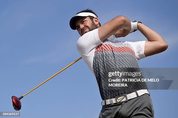 Scottish golfer Scott Jamieson tees off to the 1st hole during the last day of the Portugal Masters golf tounament at Victoria Golf Course in...