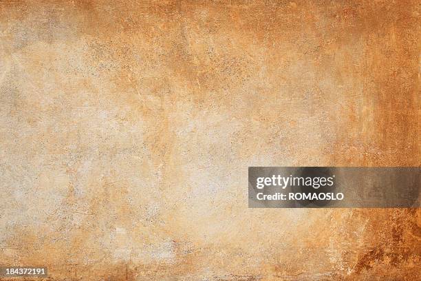 an orange and brown wall texture background - stucco stock pictures, royalty-free photos & images