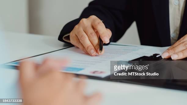 closeup of asian woman pass job interview sit in front of hr manager at office. human resource, recruitment agency concept. - performance evaluation stock pictures, royalty-free photos & images