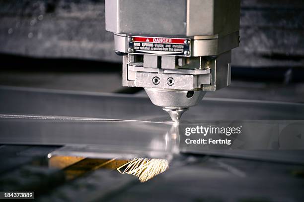 plasma laser metal cutting machine in operation - laser cutting stock pictures, royalty-free photos & images