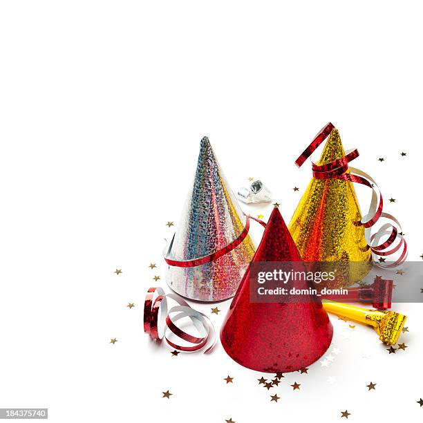 party hats, whistles, streamers, confetti, isolated on white, studio shot - birthday hat stock pictures, royalty-free photos & images