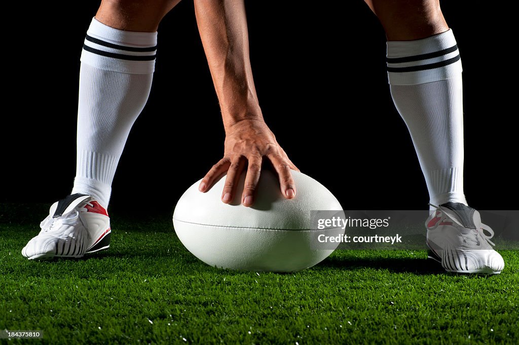 Close up of a man playing rugby ball
