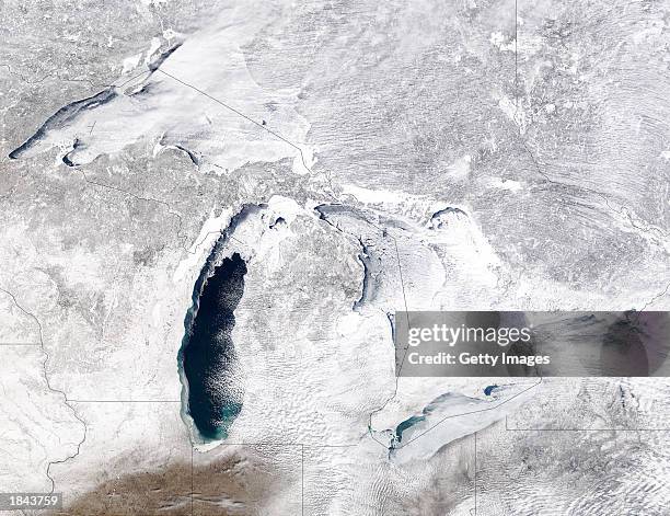 This NASA photo shows ice almost completely covering Lake Superior and Lake Huron and circling the shore of Lake Michigan on March 8, 2003. According...