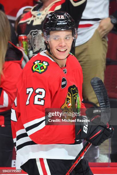 Alex Vlasic of the Chicago Blackhawks reacts after scoring a goal against the St. Louis Blues during the first period at the United Center on...