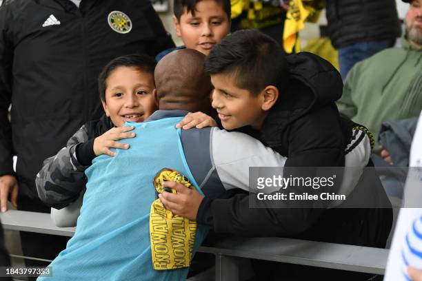Darlington Nagbe of Columbus Crew interacts with family prior to the 2023 MLS Cup against the Los Angeles FC at Lower.com Field on December 09, 2023...