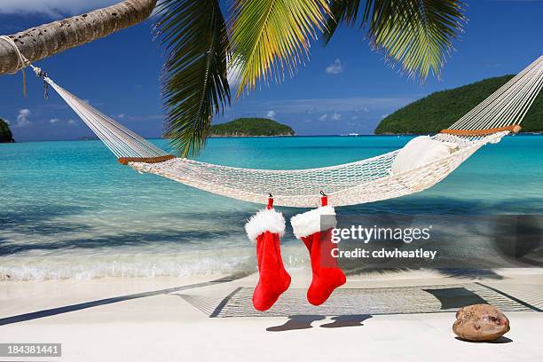 christmas stocking on a hammock at the tropical caribbean beach - caribbean culture stock pictures, royalty-free photos & images