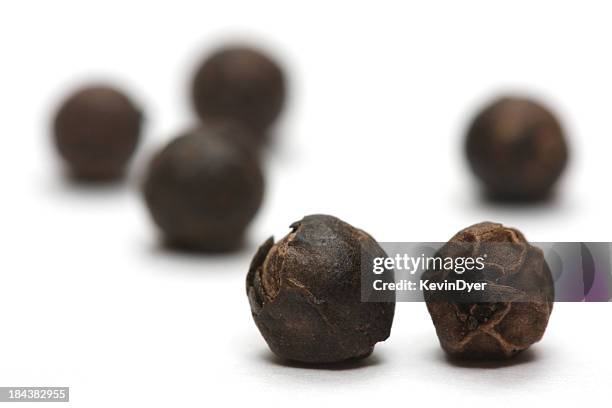 black peppercorns isolated on white background - black peppercorn stock pictures, royalty-free photos & images