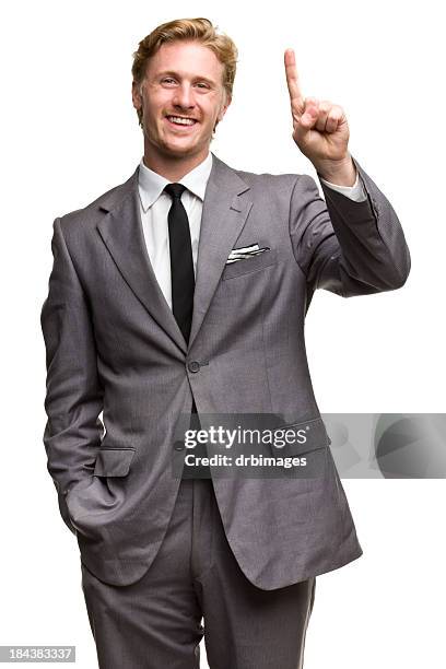 glücklicher mann in anzug mit einem finger hand geste nummer 1 - raised finger stock-fotos und bilder