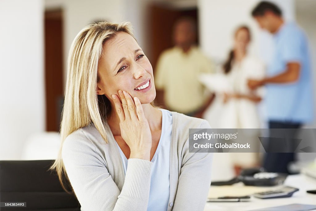 Business woman with toothache