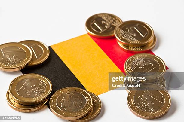 belgian flag and euros - belgië stockfoto's en -beelden