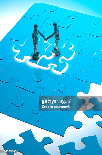 business agreement concept with wooden figures - consolidation stock pictures, royalty-free photos & images