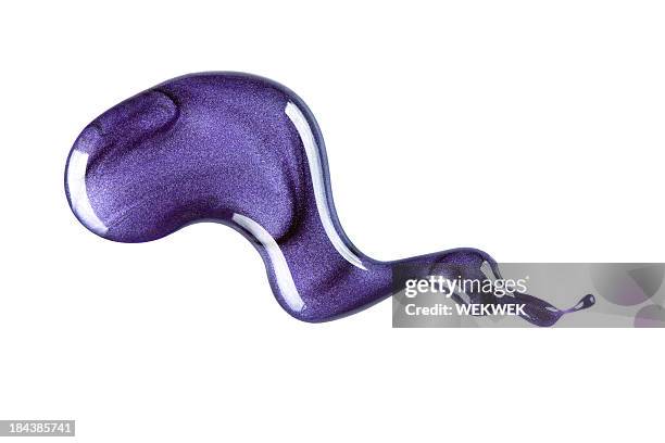 purple nail polish spread in white background - nail varnish stock pictures, royalty-free photos & images