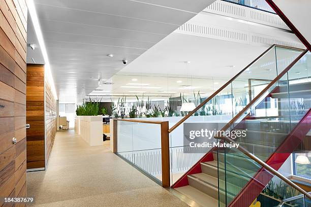 brightly lit modern office space - cool office stockfoto's en -beelden