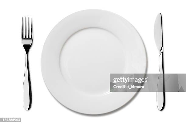 empty plate with knife and fork - white plate stock pictures, royalty-free photos & images