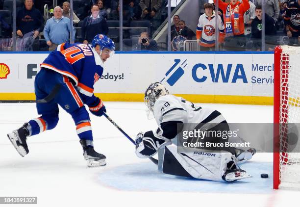 Jean-Gabriel Pageau of the New York Islanders scores the game-winning goal in overtime against Cam Talbot of the Los Angeles Kings at UBS Arena on...