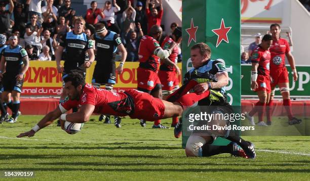 Maxime Mermoz of Toulon dives over for his second try during the Heineken Cup Pool 2 match between Toulon and Glasgow Warriors at the Felix Mayol...