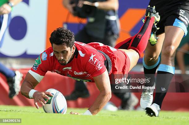 Maxime Mermoz of Toulon dives over for his first try during the Heineken Cup Pool 2 match between Toulon and Glasgow Warriors at the Felix Mayol...