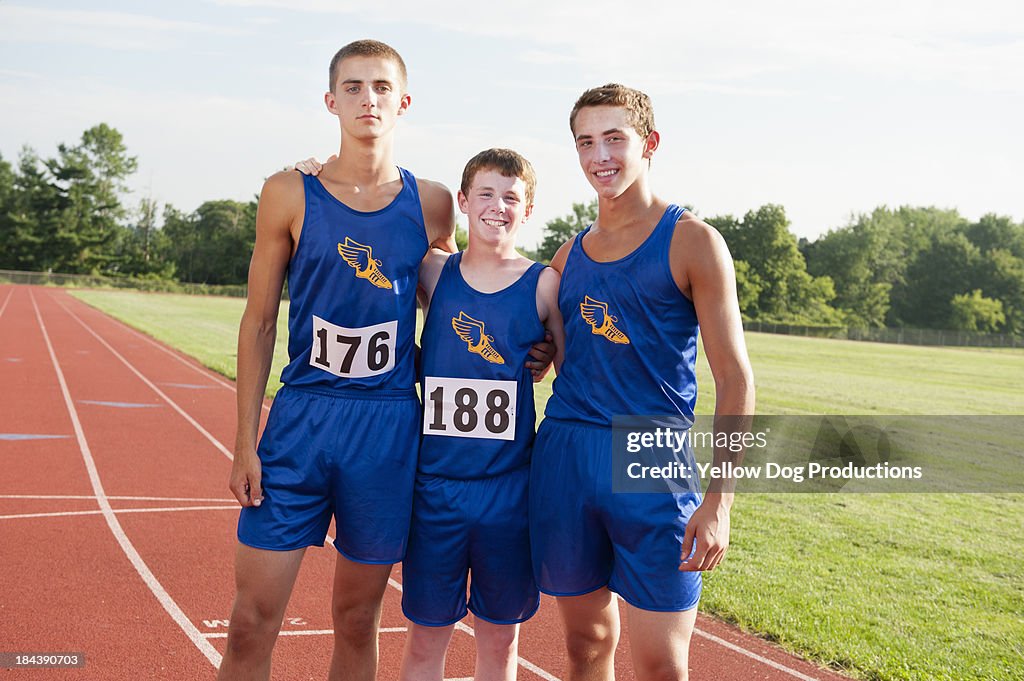 Portrait of smiling track and field teammates