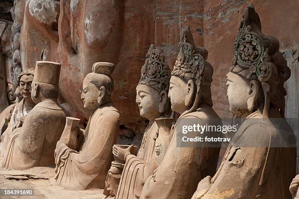 buddhist statue at dazu stone carvings - porcelain stock pictures, royalty-free photos & images