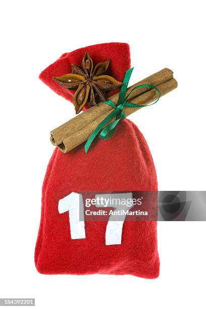 red christmas bag for advent calendar isolated on white - advent stock pictures, royalty-free photos & images
