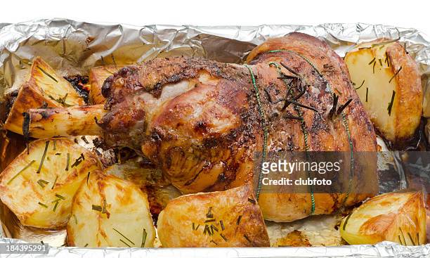 roasted leg of lamb and roast potatoes - roast lamb stock pictures, royalty-free photos & images