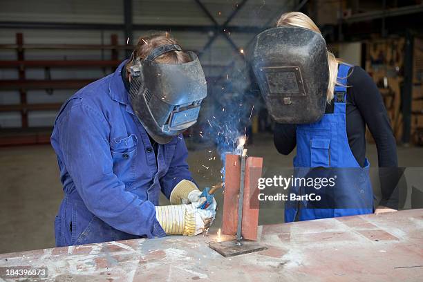 student making notes. learning for welder. - apprentice builder stock pictures, royalty-free photos & images