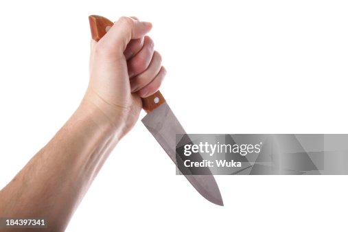 Hand holding knife Hand holding knife