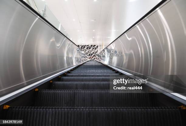 modern luxury escalators - elevator mall stock pictures, royalty-free photos & images