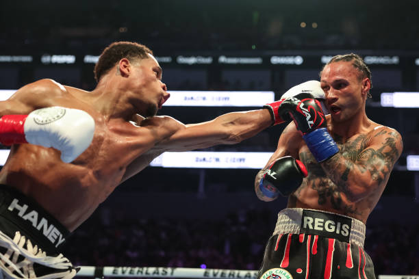 Devin Haney punches Regis Prograis during their WBC World Super Lightweight Title fight at Chase Center on December 09, 2023 in San Francisco,...