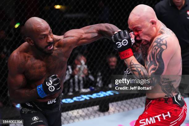 Khalil Rountree Jr. Punches Anthony Smith in a light heavyweight fight during the UFC Fight Night event at UFC APEX on December 09, 2023 in Las...