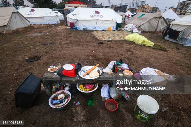 This picture shows utensils used to cook at a camp for displaced Palestinian people in Rafah, in the southern Gaza Strip where most civilians have...