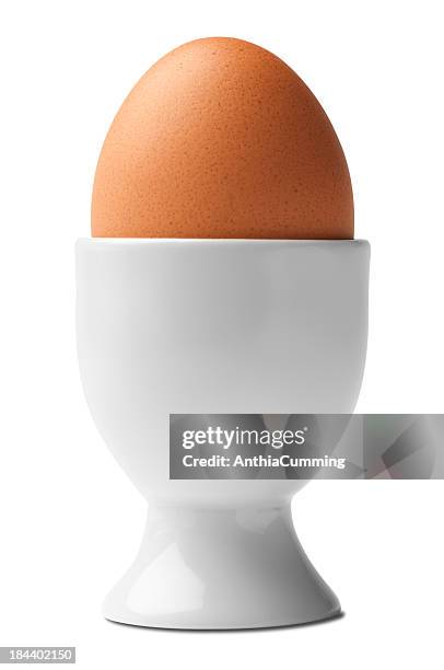 hard boiled chicken egg in egg cup isolated on white - egg cup stock pictures, royalty-free photos & images