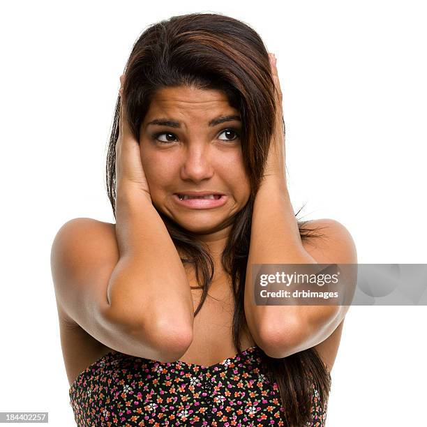 young female covering her ears with a terrified look - not listening stock pictures, royalty-free photos & images