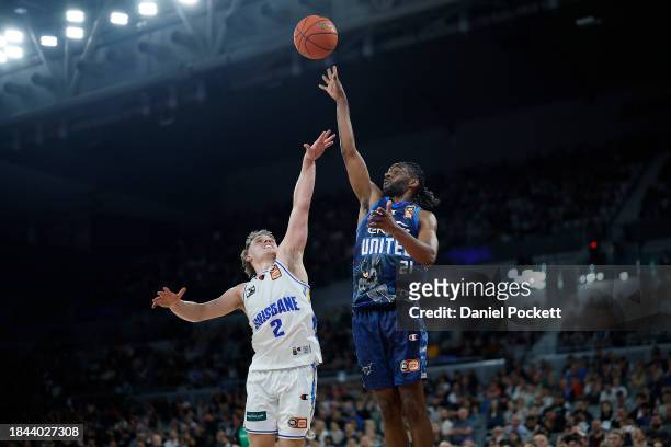 Ian Clark of United shoots under pressure from Isaac White of the Bullets during the round 10 NBL match between Melbourne United and Brisbane Bullets...