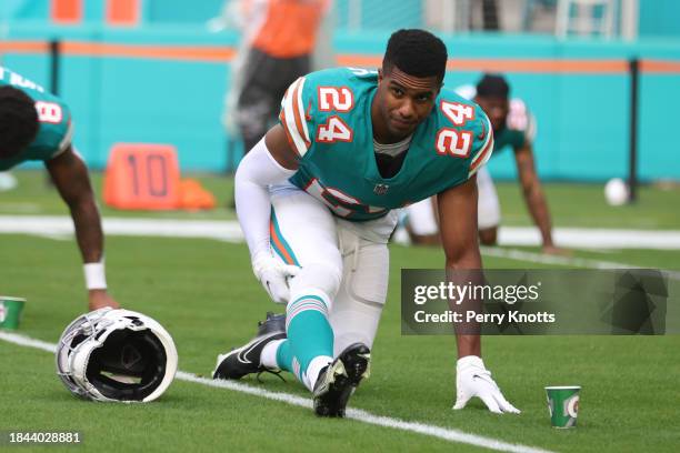 Byron Jones of the Miami Dolphins stretches on the field against the New England Patriots prior to the game at Hard Rock Stadium on January 9, 2022...