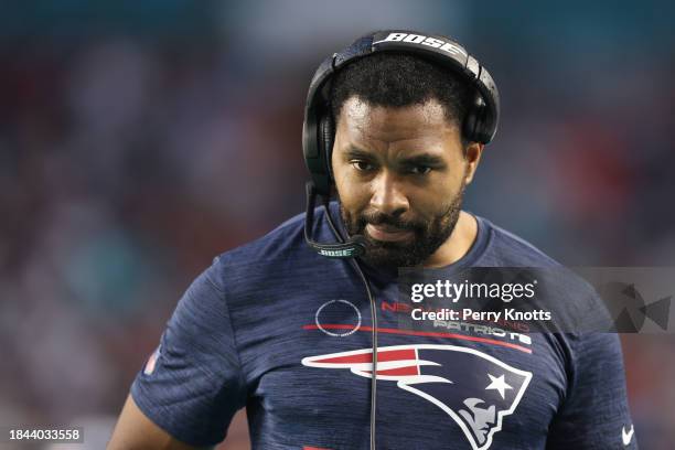 New England Patriots insider linebackers coach Jerod Mayo stands on the sideline against the Miami Dolphins prior to the game at Hard Rock Stadium on...