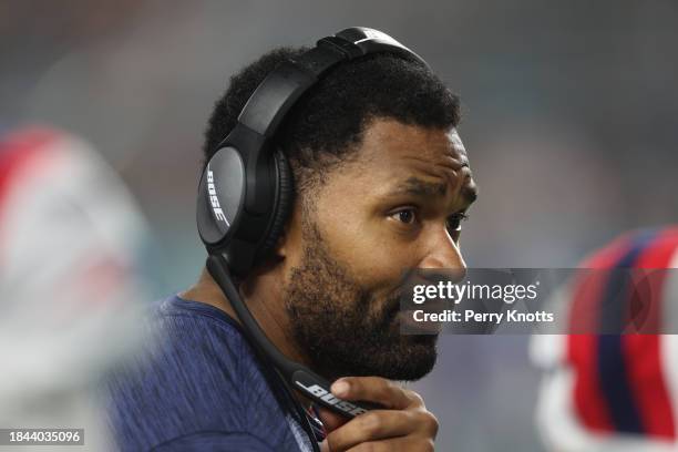 New England Patriots insider linebackers coach Jerod Mayo stands on the sideline against the Miami Dolphins prior to the game at Hard Rock Stadium on...