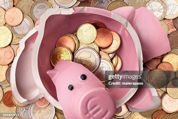 savings. broken piggy bank with euro coins - euro symbol stock pictures, royalty-free photos & images