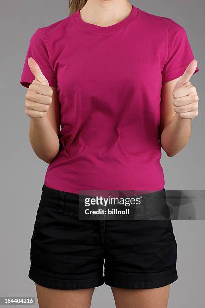 young woman posing with blank purple shirt - blank t shirt model stock pictures, royalty-free photos & images