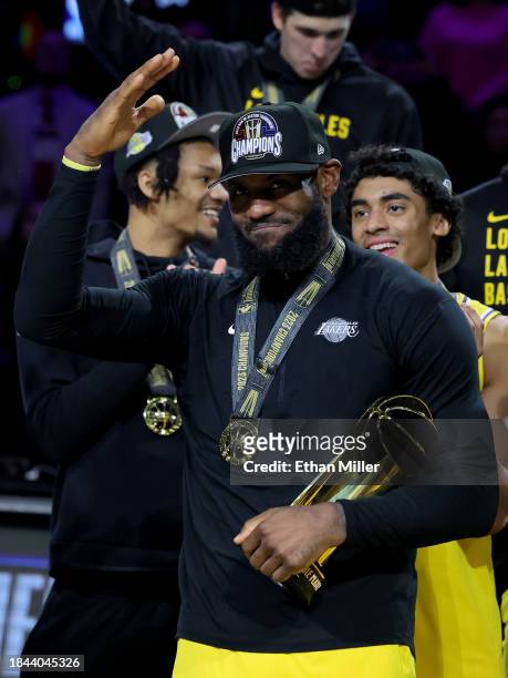 LeBron James of the Los Angeles Lakers celebrates with the MVP trophy after winning the championship game of the inaugural NBA In-Season Tournament...