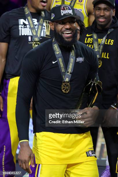 LeBron James of the Los Angeles Lakers celebrates with the MVP trophy after winning the championship game of the inaugural NBA In-Season Tournament...