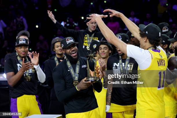 LeBron James of the Los Angeles Lakers celebrates with the MVP trophy after winning the championship game of the inaugural NBA In-Season Tournament...