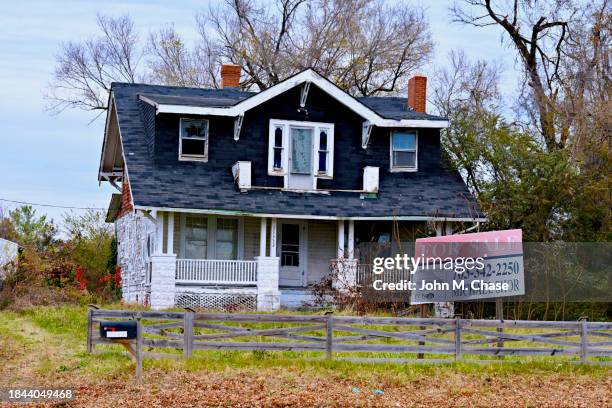 run-down home with "for sale" sign, fairfax, virginia (usa) - estate agent sign stock pictures, royalty-free photos & images